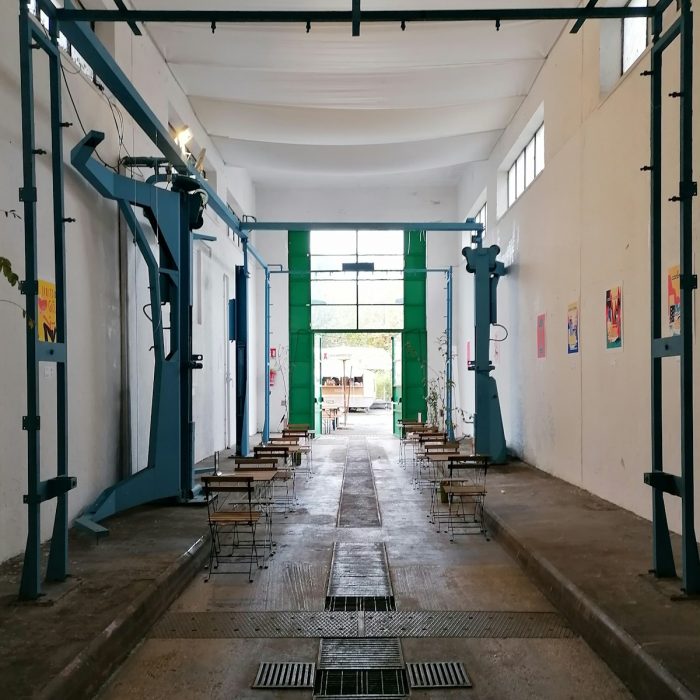 a room with a bunch of chairs and a lot of windows